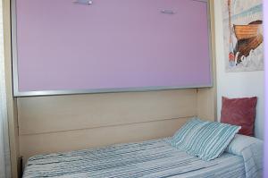 A bed or beds in a room at Apartamento San Juan de Dios