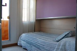 A bed or beds in a room at Apartamento San Juan de Dios