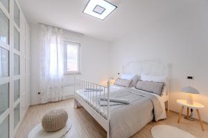 Postel nebo postele na pokoji v ubytování Apartman Gea