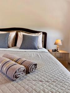 a bedroom with a bed with two pillows on it at Apartment Victor in Kotor +13 photos