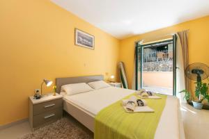 a bedroom with a large bed and a window at Villa Marija Podgora in Podgora +92 photos
