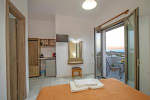 a kitchen with a table with towels on top of it at Panorama in Elafonisi