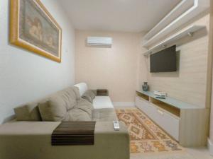 Μια τηλεόραση ή/και κέντρο ψυχαγωγίας στο Apartamento Centro Smart PL603