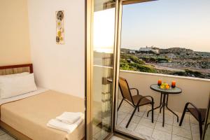 a small room with a bed and a small table at Panorama in Elafonisi