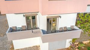 an aerial view of a building with chairs on a balcony at Panorama in Elafonisi
