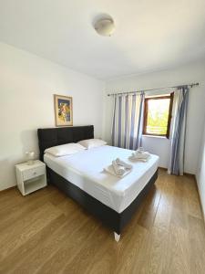 Postel nebo postele na pokoji v ubytování Apartment Gitara