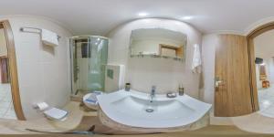 a bathroom with a large sink and a shower at Panorama in Elafonisi