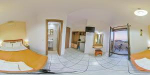 a hotel room with a bed and a kitchen at Panorama in Elafonisi