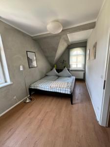 a bedroom with a bed in a attic at Altstadtquartier Hagenstraße in Bad Freienwalde