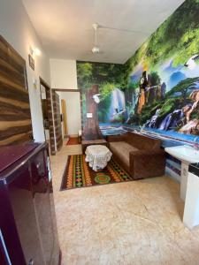 a living room with a large painting on the wall at The Venetian 2bhk Entire Homestay in Rāja Sānsi +10 photos
