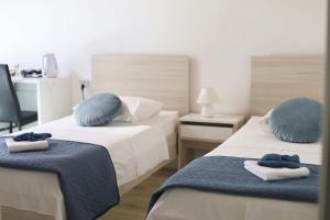 Postel nebo postele na pokoji v ubytování Guesthouse Miranda NP Krka