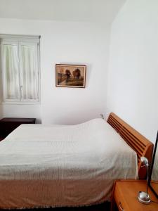 Postel nebo postele na pokoji v ubytování Ampie camere Locarno