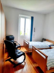 Postel nebo postele na pokoji v ubytování Ampie camere Locarno