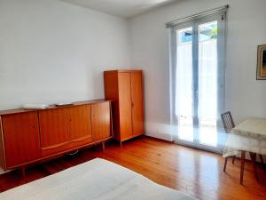 Postel nebo postele na pokoji v ubytování Ampie camere Locarno