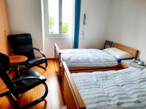 Postel nebo postele na pokoji v ubytování Ampie camere Locarno