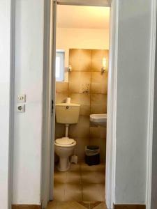a bathroom with a toilet and a sink at Fysis Panorama spectacular view in Porto Rafti +38 photos