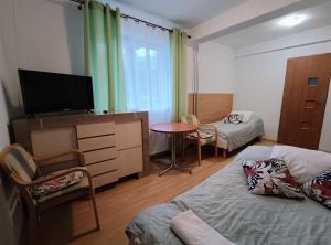 Posteľ alebo postele v izbe v ubytovaní Bryza Międzyzdroje