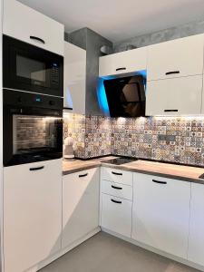 Køkken eller tekøkken på Park Side Apartment Green Life Resort