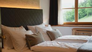 Voodi või voodid majutusasutuse Chalet Grumer Suites&Spa toas