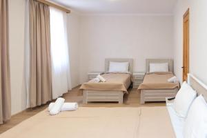 Postel nebo postele na pokoji v ubytování Hotel Veranda