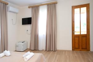 TV a/nebo společenská místnost v ubytování Hotel Veranda