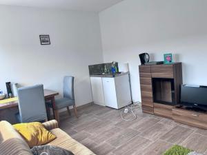 TV a/nebo společenská místnost v ubytování TOP 1 Zimmer für 1-2Personen