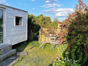 A garden outside 4 person holiday home in SÖLVESBORG-By Traum