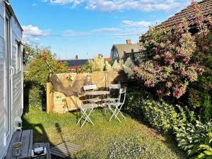 A garden outside 4 person holiday home in SÖLVESBORG-By Traum