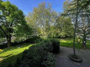 a view of a park with trees and bushes at Bonn Lounge in Bonn