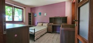 Postel nebo postele na pokoji v ubytování Apartmán U jezírka - Relax v Chřibech - Kroměříž - Kostelany
