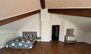 a bedroom with a bed and a television in it at Villa cedra centre ville ifrane zéro six soixante-neuf soixante-huit 3828 in Ifrane