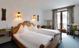 Posteľ alebo postele v izbe v ubytovaní Alpenappartement Europa + 23 fotografií