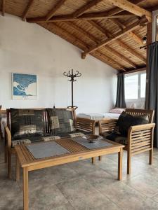 a living room with a couch and a table at obzor, orkinos in Obzor