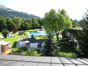 an aerial view of a house with a swimming pool at Alpenappartement Europa in Sankt Johann in Tirol