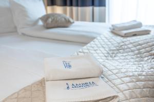 Łóżko lub łóżka w pokoju w obiekcie Ambria Apartments Promenada