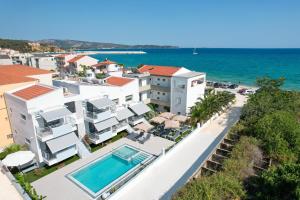 an aerial view of a resort with a swimming pool at Sourinis Luxury Suites in Limenaria