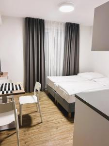 Postel nebo postele na pokoji v ubytování Apartamenty Villa Baltica Rewal - jacuzzi na dachu, wi-fi, parking w cenie