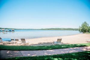 a group of chairs sitting on a beach at Northern Nights Chalet by Wanderlust Abodes in Bellaire