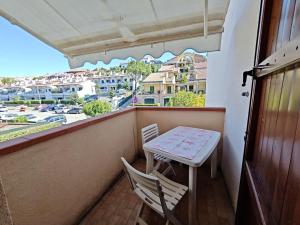 a table and two chairs on a balcony with a view at L06 - Trilocale a 300 mt dal mare in Ancona