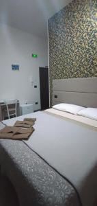 Katil atau katil-katil dalam bilik di B&b Regina Elena - Calabria