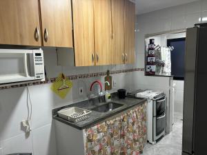 Kuchyň nebo kuchyňský kout v ubytování Praia Grande