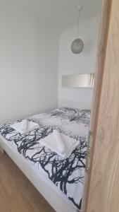 Postel nebo postele na pokoji v ubytování Tuana