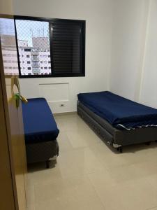 Postel nebo postele na pokoji v ubytování Praia Grande + 36 fotografií