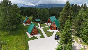an aerial view of a group of cottages at Hedonist Village in Žabljak