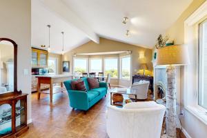 a living room with a blue couch and a fireplace at Firepit Lagoon in Oceanside