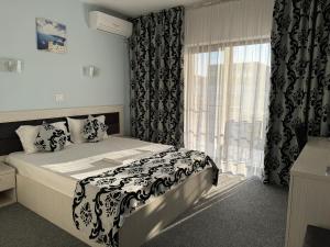 Postel nebo postele na pokoji v ubytování Vila Zara