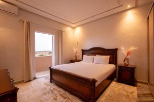 a bedroom with a bed and a window at Blumen Villa in Marrakesh +28 photos
