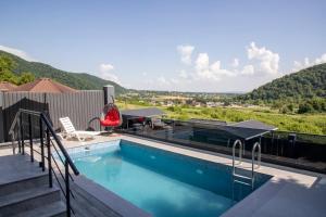 a swimming pool with a view of a mountain at Villa Bella Vue in Gabala