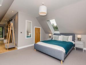 a bedroom with a bed and a ladder in it at Osprey Apartment in Kingussie