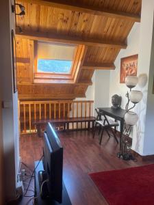 Posedenie v ubytovaní Duplex 80 m2 con vistas a la montaña